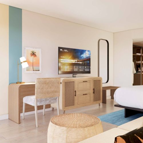 The image shows a modern hotel room with a bed, TV, desk, chair, stylish lamp, wall art, and neutral decor.