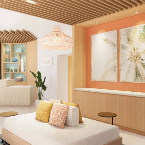 The image shows a modern lounge with comfy seating, tropical decor, soft lighting, and colorful accents creating a warm, inviting atmosphere.